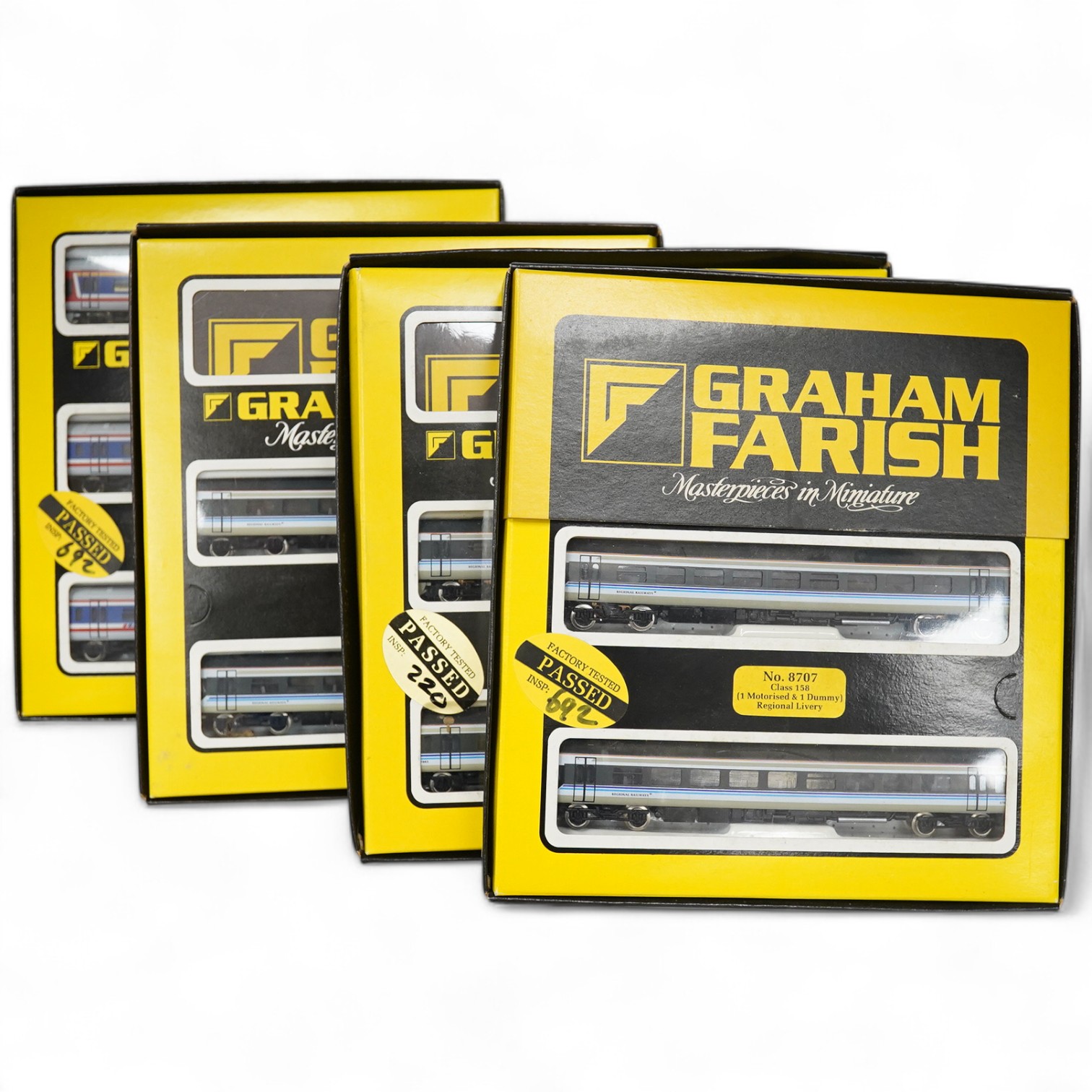 Four boxed Graham Farish N gauge railway train packs; two BR Regional Railways Class 158 2-car DMUs (8707), plus additional 2-car coach set (0887), and a Network SouthEast Class 159 3-car DMU (8748). Condition - good.